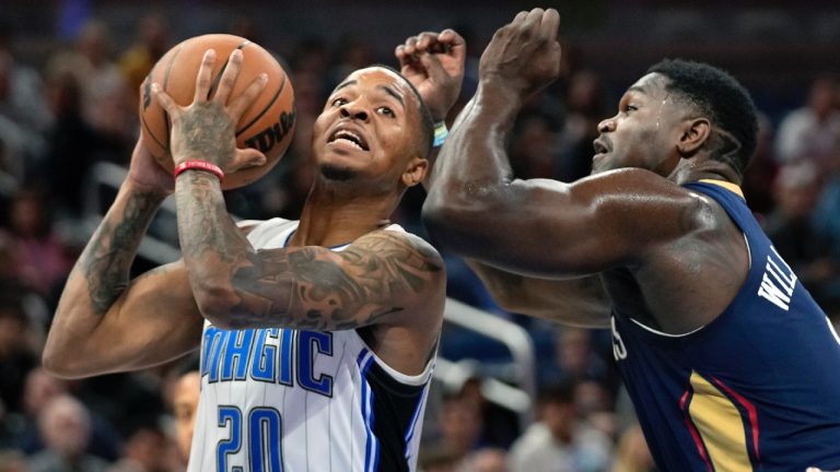 Orlando Magic guard Markelle Fultz (20) looks for a shot against New Orleans Pelicans forward Zion Williamson during the first half of an NBA pre-season basketball game, Tuesday, Oct. 17, 2023, in Orlando, Fla. (John Raoux/AP)