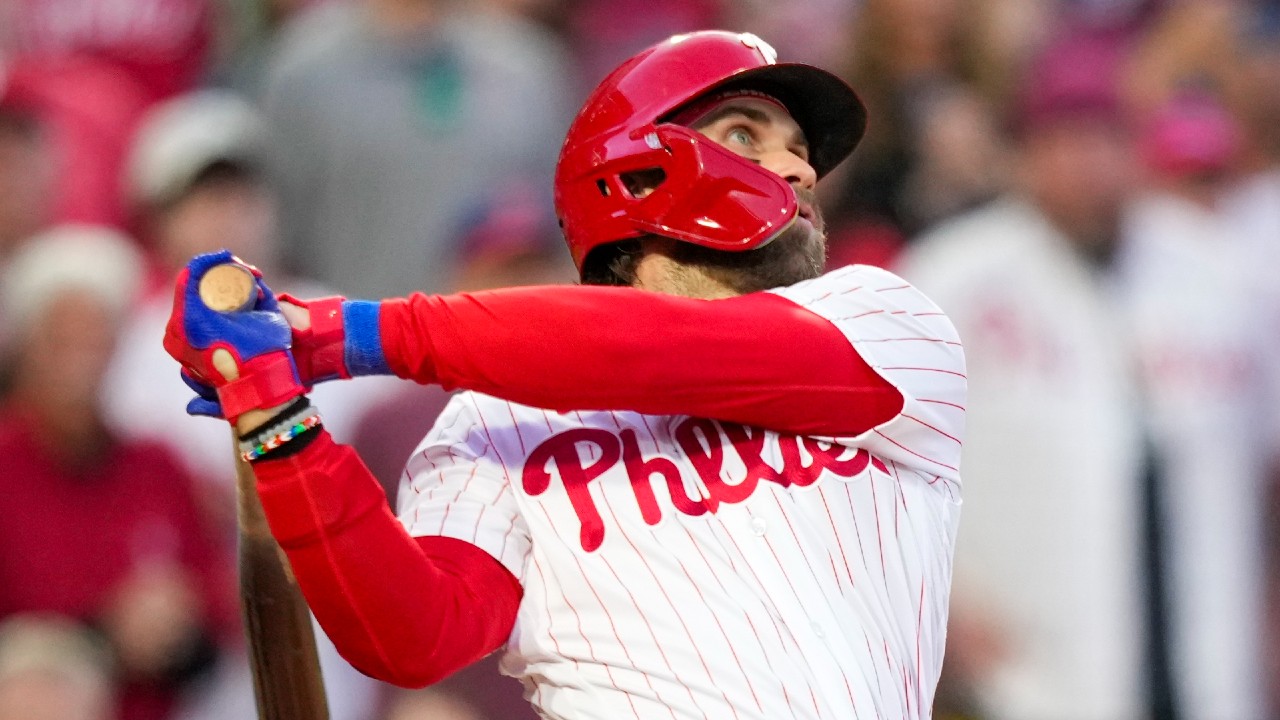 Bryce Harper wears green Phillie Phanatic suit