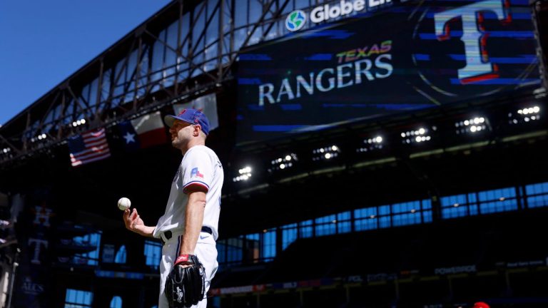 Texas Rangers starting pitcher Max Scherzer tosses the baseball as he waits for fielding practice in Arlington, Texas, Friday, Oct. 13, 2023. (Tom Fox/The Dallas Morning News via AP)