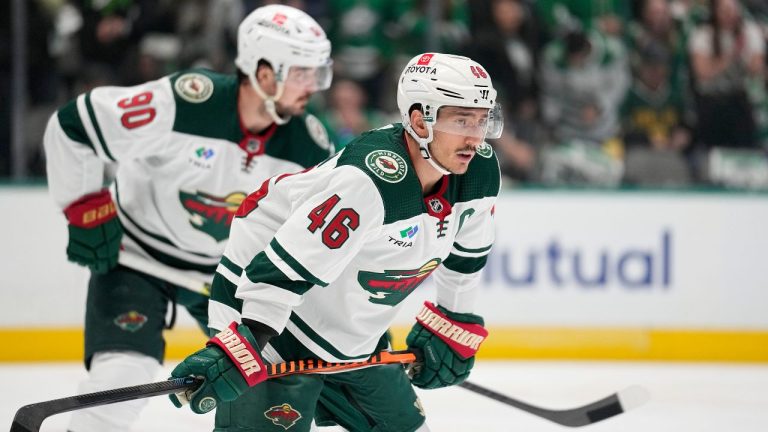 Minnesota Wild's Jared Spurgeon and Marcus Johansson prepare for a face-off against the Dallas Stars during Game 5 of an NHL hockey Stanley Cup first-round playoff series, Tuesday, April 25, 2023, in Dallas. (Tony Gutierrez/AP Photo)