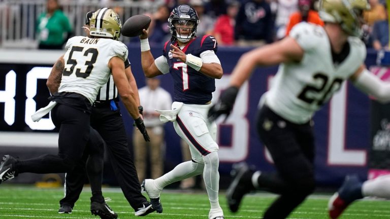 Houston Texans quarterback C.J. Stroud throws as New Orleans Saints linebacker Zack Baun defends in the first half of an NFL football game in Houston, Sunday, Oct. 15, 2023. (Eric Gay/AP Photo)