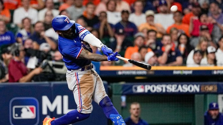 Texas Rangers' Adolis Garcia hits a home run during the eighth inning of Game 7 of the baseball AL Championship Series against the Houston Astros Monday, Oct. 23, 2023, in Houston. (David J. Phillip/AP)