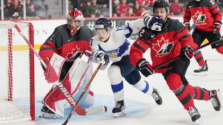 Finland’s Topi Ronni, centre, skates between Canada goaltender Thomas Milic, left, and Nolan Allen during first period IIHF World Junior Hockey Championship pre-tournament hockey action in Halifax on Friday, December 23, 2022. (Darren Calabrese/CP)