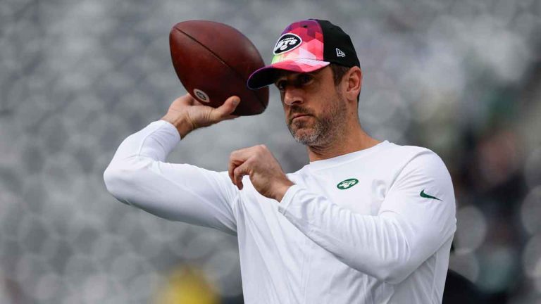 New York Jets quarterback Aaron Rodgers throws before an NFL football game against the Philadelphia Eagles. (Adam Hunger/AP)