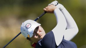 United States' Angel Yin plays her tee shot on the 4th hole during her single match at the Solheim Cup golf tournament. (Bernat Armangue/AP)