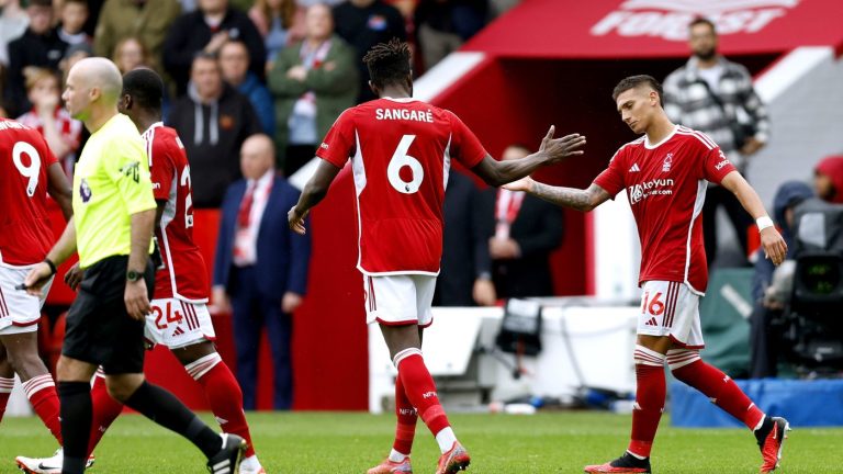 Nottingham Forest's Nicolas Dominguez, right, celebrates scoring their side's first goal of the game during their English Premier League soccer match against Brentford at City Ground, Nottingham, England, Sunday, Oct. 1, 2023. (Nigel French/PA via AP)