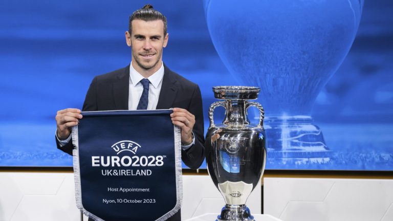 Gareth Bale, Welsh soccer player and ambassador, poses after U.K. and Ireland were elected to host the Euro 2028 fooball tournament in Nyon, Switzerland, Tuesday, October 10, 2023. (Jean-Christophe Bott/Keystone via AP)