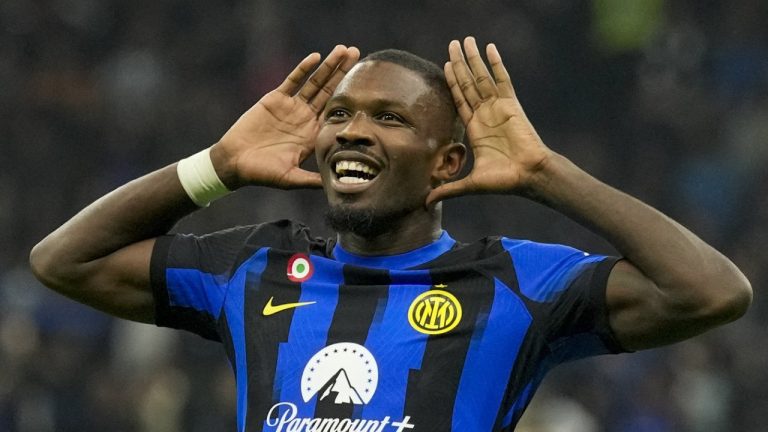 Inter Milan's Marcus Thuram celebrates after scoring his side's opening goal during the Serie A soccer match between Inter Milan and Roma at the San Siro Stadium, in Milan, Italy, Sunday, Oct. 29, 2023. (Antonio Calanni/AP)