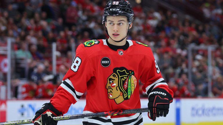 Connor Bedard #98 of the Chicago Blackhawks looks on against the Detroit Red Wings during the third period of preseason game at the United Center on October 03, 2023 in Chicago, Illinois. (Photo by Michael Reaves/Getty Images)