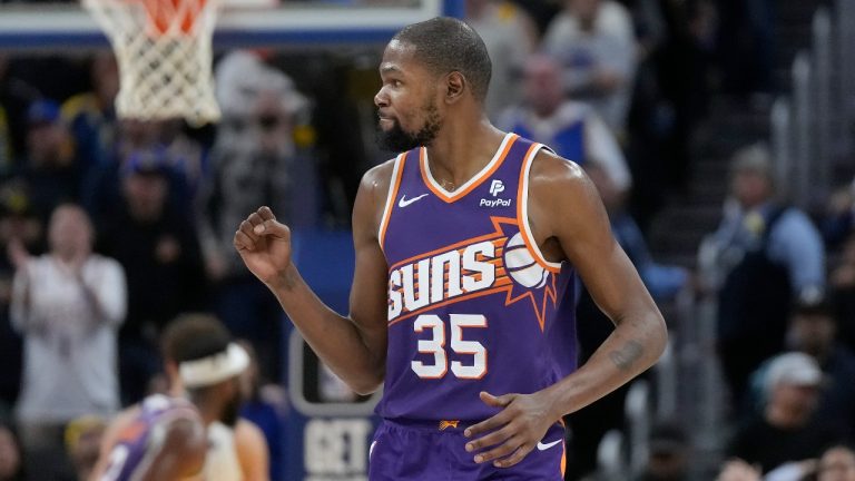 Phoenix Suns forward Kevin Durant celebrates during the second half of the team's NBA basketball game against the Golden State Warriors in San Francisco, Tuesday, Oct. 24, 2023. (Jeff Chiu/AP Photo)