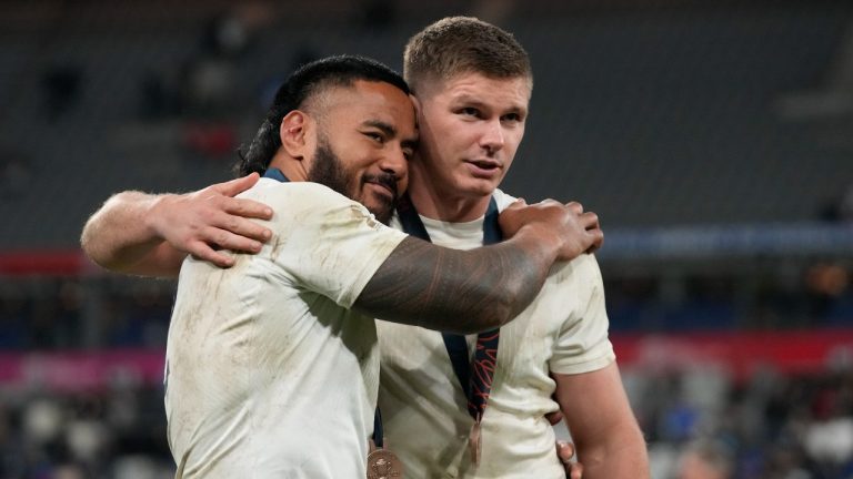 England's Owen Farrell, right, and Manu Tuilagi celebrate after the Rugby World Cup third place match between England and Argentina at the Stade de France in Saint-Denis, outside Paris, Friday, Oct. 27, 2023. (Themba Hadebe/AP)