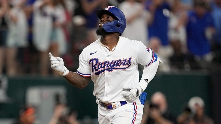 Texas Rangers' Adolis Garcia gestures after hitting a three-run home run in the second inning of Game 3 of a baseball AL Division Series against the Baltimore Orioles on Tuesday, Oct. 10, 2023, in Arlington, Texas. (Tony Gutierrez/AP Photo)