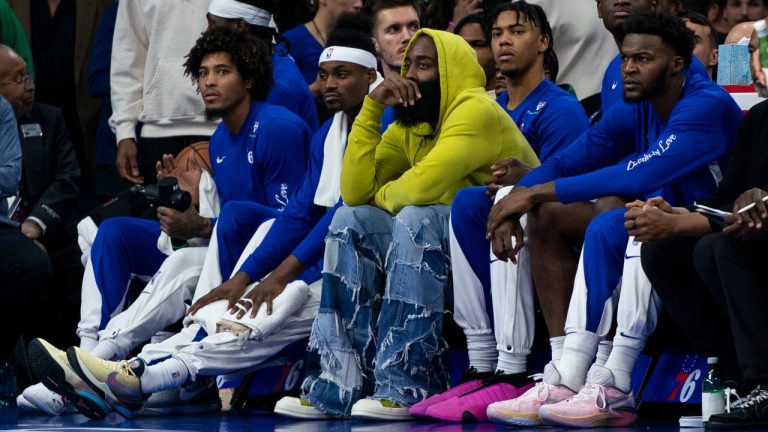 Philadelphia 76ers' James Harden, center, looks on from the bench in street clothes during the NBA basketball game against the Portland Trail Blazers, Sunday, Oct. 29, 2023, in Philadelphia. The 76ers won 126-98. (Chris Szagola/AP Photo)