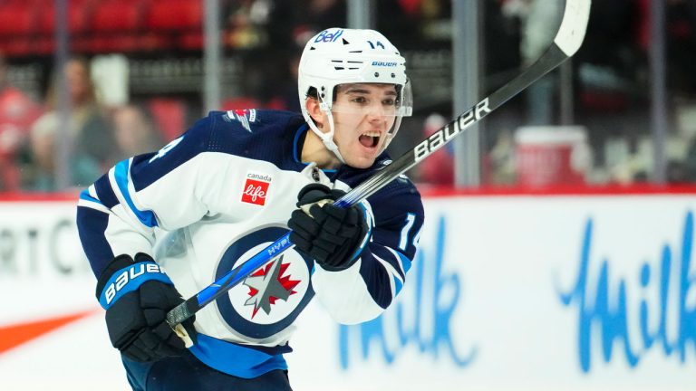 Winnipeg Jets defenceman Ville Heinola (14) takes a shot on net while taking on the Ottawa Senators in first period pre-season NHL hockey action in Ottawa. (Sean Kilpatrick/THE CANADIAN PRESS)