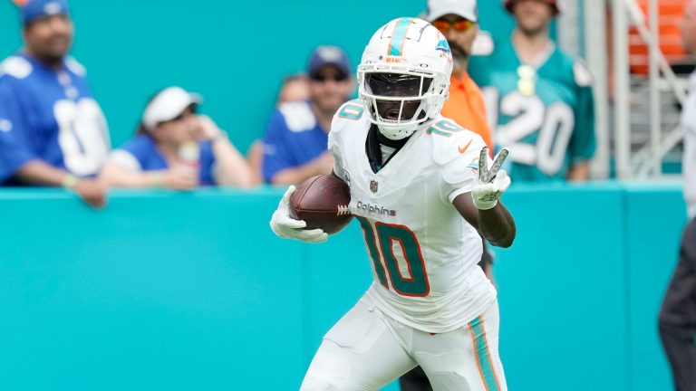 Miami Dolphins wide receiver Tyreek Hill gestures as he runs for a touchdown during the second half of an NFL game against the New York Giants, Sunday, Oct. 8, 2023, in Miami Gardens, Fla. (AP)