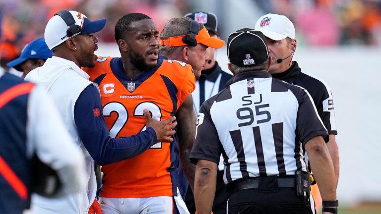 Denver Broncos safety Kareem Jackson (22) reacts to being disqualified from the game after a hit on Green Bay Packers tight end Luke Musgrave during the second half of an NFL football game in Denver, Sunday, Oct. 22, 2023. (Jack Dempsey/AP Photo)