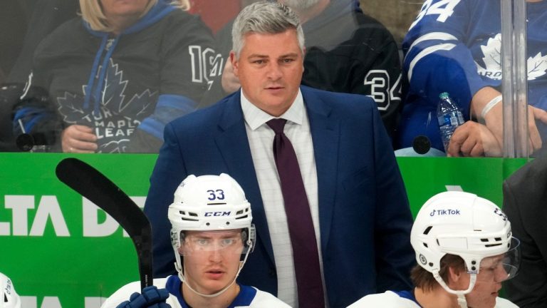 Toronto Maple Leafs head coach Sheldon Keefe watches against the Detroit Red Wings in the third period of an NHL preseason hockey game Saturday, Oct. 7, 2023, in Detroit. (Paul Sancya/AP Photo)