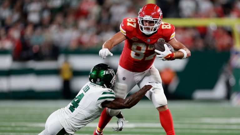 Kansas City Chiefs tight end Travis Kelce (87) tries to break a tackle by New York Jets cornerback D.J. Reed (4) of an NFL football game, Sunday, Oct. 1, 2023, in East Rutherford, N.J. (Adam Hunger/AP)