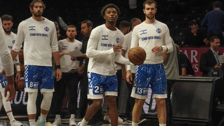 Members of Israel's Maccabi Ra'anana basketball team wear shirts in support of Israel during warmups before a preseason NBA basketball game against the Brooklyn Nets, Thursday, Oct. 12, 2023, in New York. (Bebeto Matthews/AP Photo)