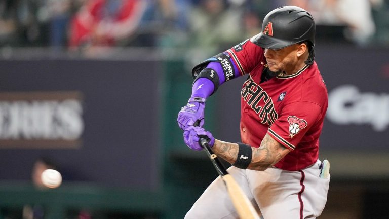 Arizona Diamondbacks' Ketel Marte hits a RBI double off Texas Rangers starting pitcher Nathan Eovaldi during the fifth inning in Game 1 of the baseball World Series Friday, Oct. 27, 2023, in Arlington, Texas. (Brynn Anderson/AP)