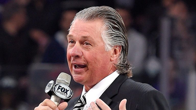 Former Los Angeles Kings coach Barry Melrose speaks to fans as he is honored prior to an NHL hockey game between the Kings and the Calgary Flames, Thursday, Feb. 12, 2015, in Los Angeles. Melrose is stepping away from his role at the ESPN network after being diagnosed with Parkinson's disease, ESPN announced Tuesday, Oct. 10, 2023. (Mark J. Terrill/ AP File)