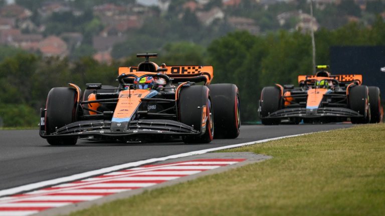 Australian Formula One driver Oscar Piastri of McLaren F1 Team steers his car followed by British Formula One driver Lando Norris of McLaren F1 Team during the first practice session ahead of Sunday's Formula One Hungarian Grand Prix auto race, at the Hungaroring racetrack in Mogyorod, near Budapest, Hungary, Friday, July 21, 2023. (Denes Erdos/AP)