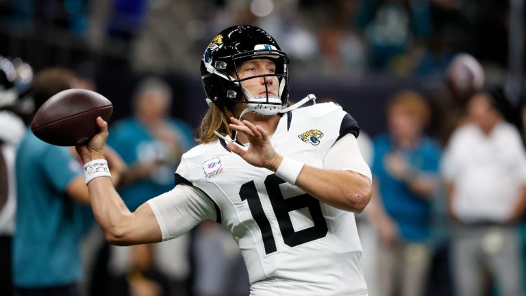 Jacksonville Jaguars quarterback Trevor Lawrence (16) warms before an NFL football game against the New Orleans Saints in New Orleans, Thursday, Oct. 19, 2023. (Butch Dill/AP)