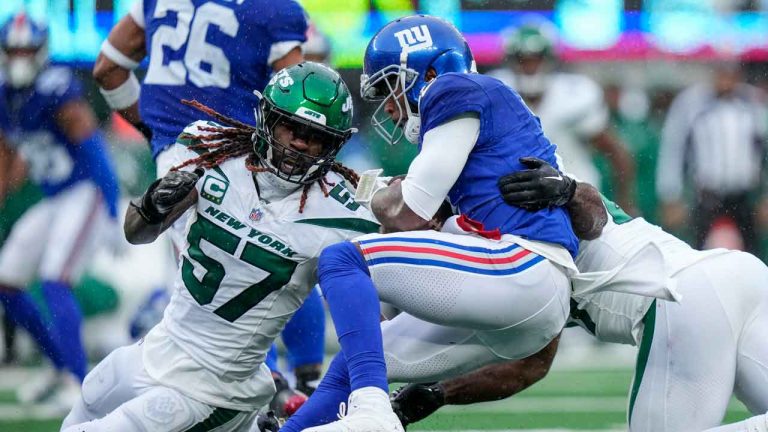 New York Giants quarterback Tyrod Taylor (2) is tackled on the run by New York Jets linebacker C.J. Mosley, right, during the first half of an NFL football game. (Frank Franklin II/AP)