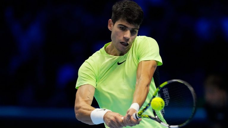 Spain's Carlos Alcaraz returns the ball to Germany's Alexander Zverev during their singles tennis match of the ATP World Tour Finals at the Pala Alpitour, in Turin, Italy, Monday, Nov. 13, 2023. (Antonio Calanni/AP)