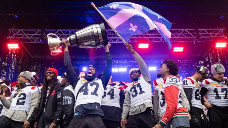 Montreal Alouettes celebrate during the team's Grey Cup parade, in Montreal, Wednesday, Nov. 22, 2023. (CP/Ryan Remiorz)