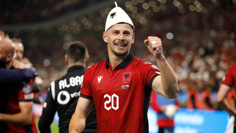 Albania's Ylber Ramadani celebrates their victory at the Euro 2024 group E qualifying soccer match between Albania and Czech Republic at Air Albania stadium in Tirana, Albania, Thursday, Oct. 12, 2023. (AP Photo/Franc Zhurda)