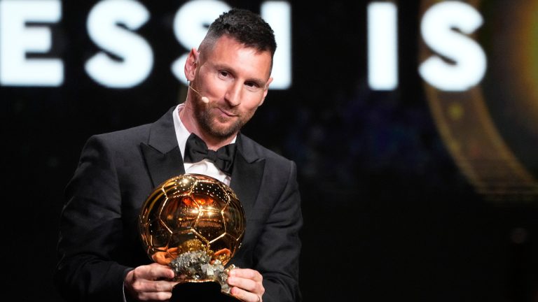 Inter Miami and Argentina national team player Lionel Messi receives the 2023 Ballon d'Or trophy during the 67th Ballon d'Or award ceremony. (Michel Euler/AP) 