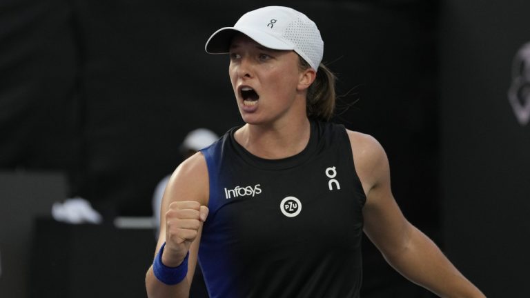 Iga Swiatek, of Poland, celebrates winning a point during a women's singles final of the WTA Finals tennis championships against Jessica Pegula, of the United States, in Cancun, Mexico, Monday, Nov. 6, 2023. (Fernando Llano/AP)