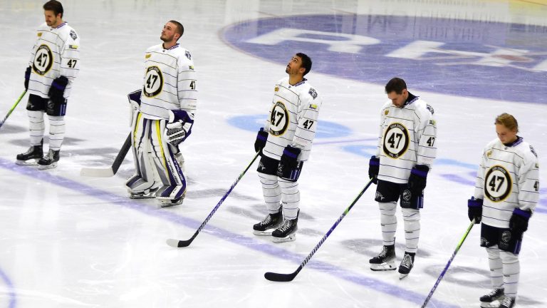 Nottingham Panthers players wearing No. 47, Adam Johnson's number, pay tribute before the Adam Johnson memorial game between Nottingham Panthers and Manchester Storm at the Motorpoint Arena, Nottingham, England, Saturday, Nov. 18, 2023. (AP)