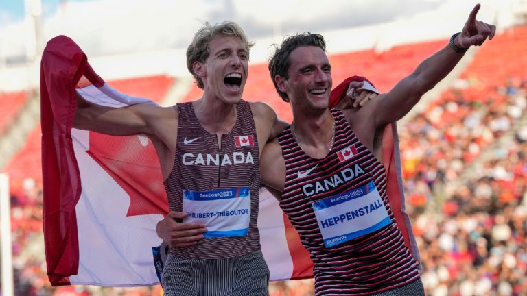 Canada's Charles Philibert-Thiboutot and teammate Robert Heppenstall celebrate after the men's 1500-meters final at the Pan American Games in Santiago, Chile, Thursday, Nov. 2, 2023. Philibert-Thiboutot won the gold medal and Heppenstall the silver medal. (Natacha Pisarenko/AP)