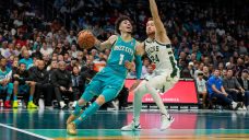 Lillard, Bucks stay perfect in tournament with win over Hornets