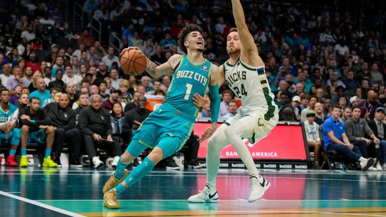 Charlotte Hornets guard LaMelo Ball drives to the basket past Milwaukee Bucks guard Pat Connaughton during the second half of an NBA basketball game on Friday, Nov. 17, 2023, in Charlotte, N.C. (Chris Carlson/AP)