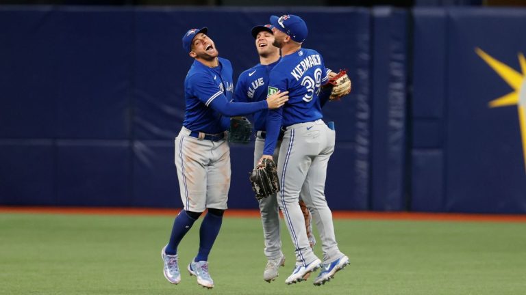 Toronto Blue Jays outfielder's George Springer, left, Daulton Varsho, center and Kevin Kiermaier celebrate after the Jays defeated the Tampa Bay Rays during a baseball game, Sunday, Sept. 24, 2023, in St. Petersburg, Fla. (Scott Audette/AP Photo)