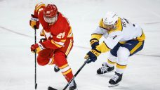 Flames rally with three goals in third period to beat Predators at home