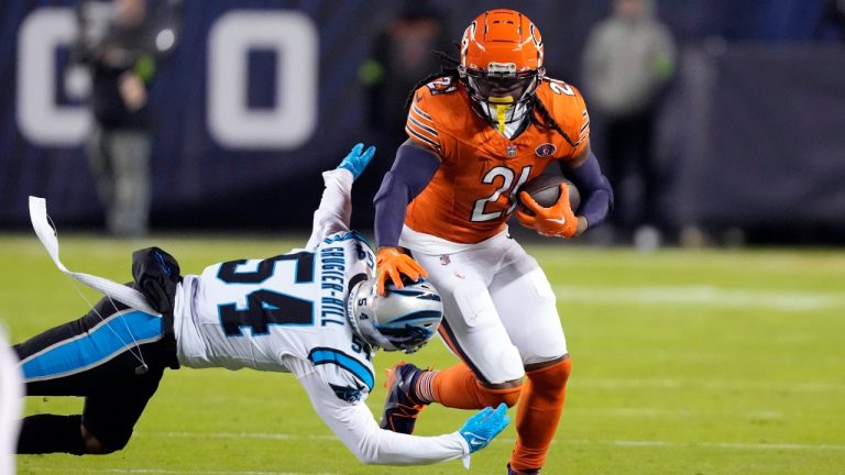 Chicago Bears running back D'Onta Foreman (21) is tackled by Carolina Panthers linebacker Kamu Grugier-Hill (54) during the first half of an NFL football game. (Charles Rex Arbogast/AP)