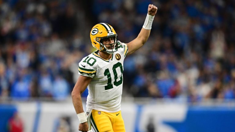 Green Bay Packers quarterback Jordan Love runs up field after throwing a touchdown to wide receiver Christian Watson during the second half of an NFL football game against the Detroit Lions, Thursday, Nov. 23, 2023, in Detroit. (David Dermer/AP)