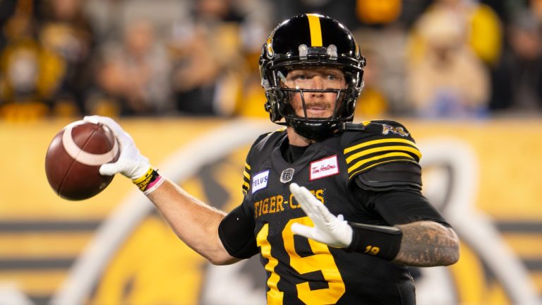 Hamilton Tiger-Cats quarterback Bo Levi Mitchell (19) gets set to throw against the B.C. Lions during first half CFL football game action in Hamilton, Ont. on Friday, October 13, 2023. (Peter Power/CP)