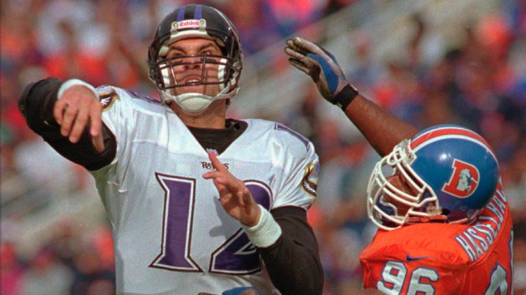 Denver Broncos defensive end Harold Hasselbach, right, pressures Baltimore Ravens quarterback Vinny Testaverde during an NFL football game in Denver, Sunday, Oct. 20, 1996. Hasselbach, who won a Grey Cup and two Super Bowls over his professional football career, has died at 56. (CP/AP-Joe Mahoney)