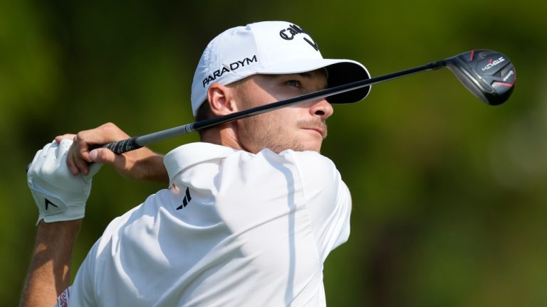 Nicolai Hojgaard of Denmark plays his second shot on the second hole hole during the final round of the DP World Tour Championship golf tournament. (Kamran Jebreili/AP)