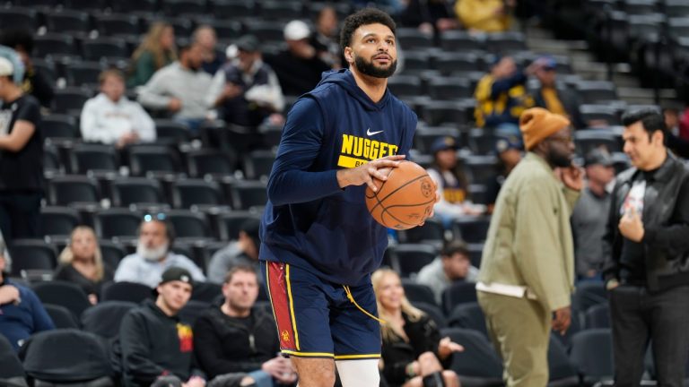 Sidelined by a hamstring injury, Denver Nuggets guard Jamal Murray (27) practices before the first half of an NBA basketball game Wednesday, Nov. 8, 2023, in Denver. (David Zalubowski/AP Photo)