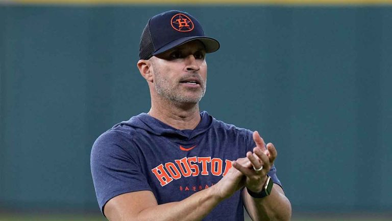 Houston Astros bench coach Joe Espada talks with players before a baseball game against the Tampa Bay Rays,. (Kevin M. Cox/AP)