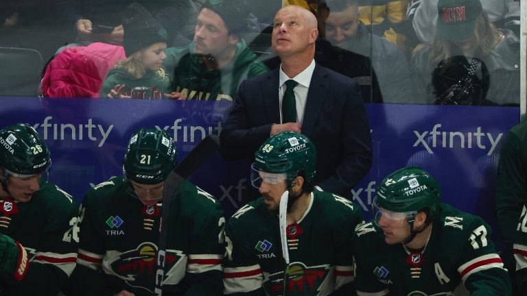 Minnesota Wild head coach John Hynes looks up to the scoreboard during the first period of an NHL hockey game against the St. Louis Blues, Tuesday, Nov. 28, 2023, in St Paul, Minn. (Matt Krohn/AP)