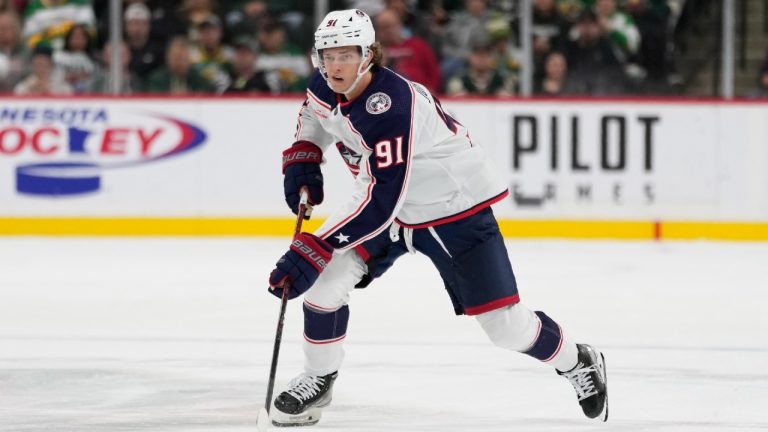 Columbus Blue Jackets centre Kent Johnson skates with the puck during the third period of an NHL hockey game against the Minnesota Wild Saturday, Oct. 21, 2023, in St. Paul, Minn. (Abbie Parr/AP)