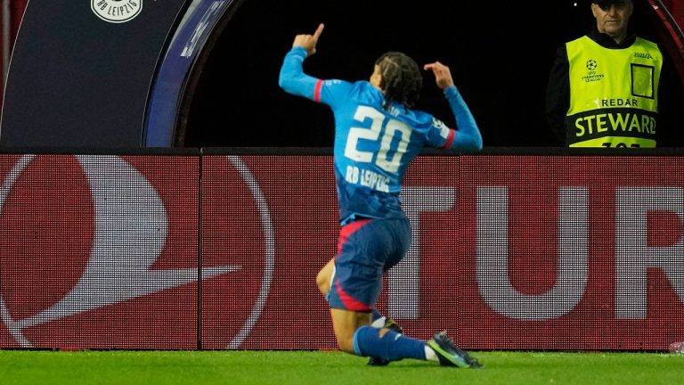 Leipzig's Xavi Simons celebrates after scoring the opening goal during the Group G Champions League soccer match between Red Star Belgrade and RB Leipzig. (Darko Vojinovic/AP)