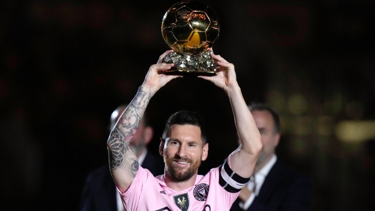 Inter Miami forward Lionel Messi holds his Ballon d'Or trophy before the team's club friendly soccer match against New York City FC, Friday, Nov. 10, 2023, in Fort Lauderdale, Fla. (Lynne Sladky/AP)